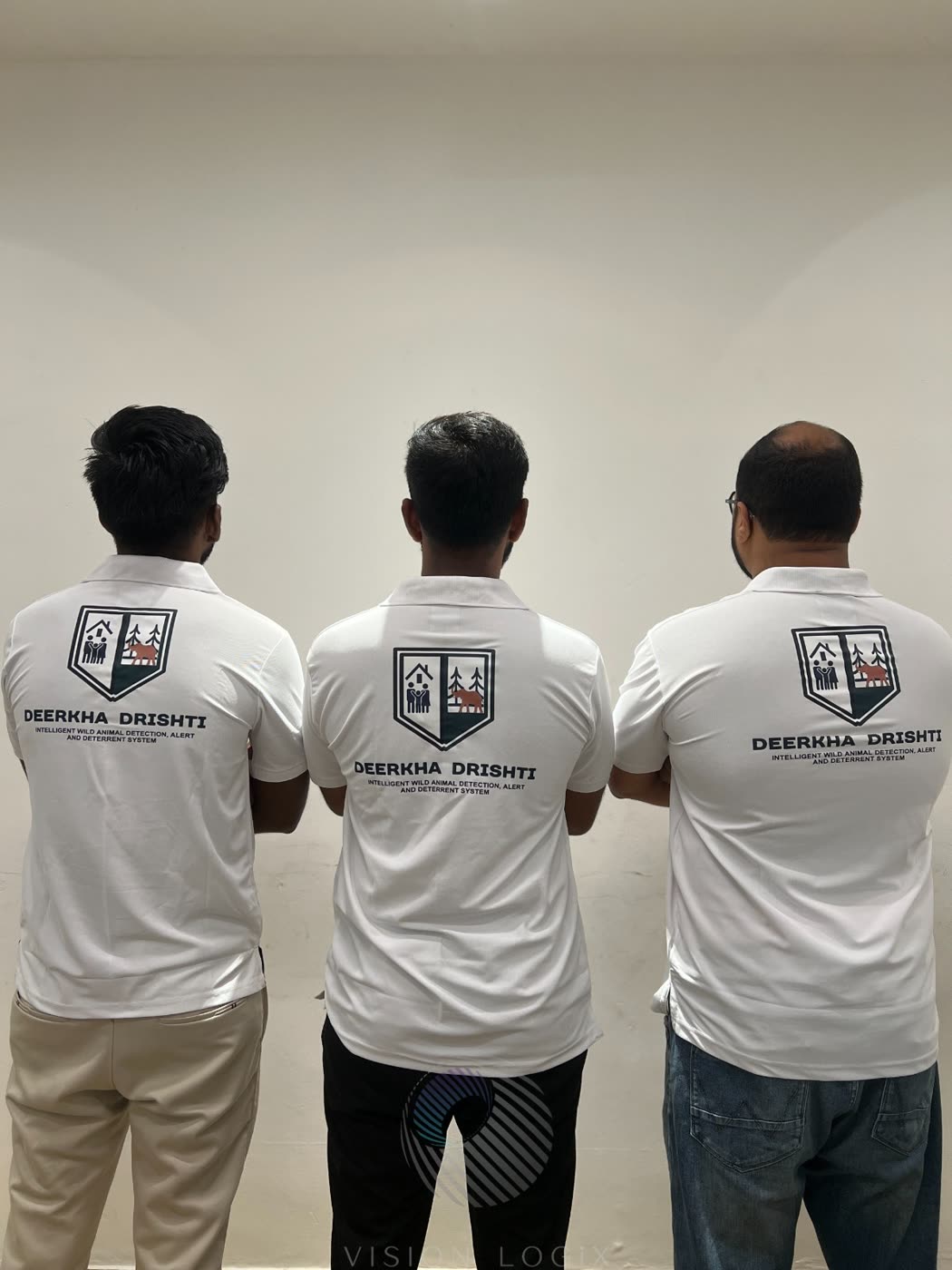 Three Deerkha Drishti team shirts showing the product logo and strapline.